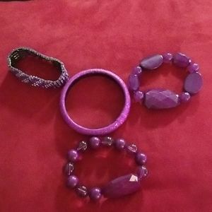 Set of four purple bracelets